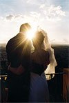 sunset wedding kiss